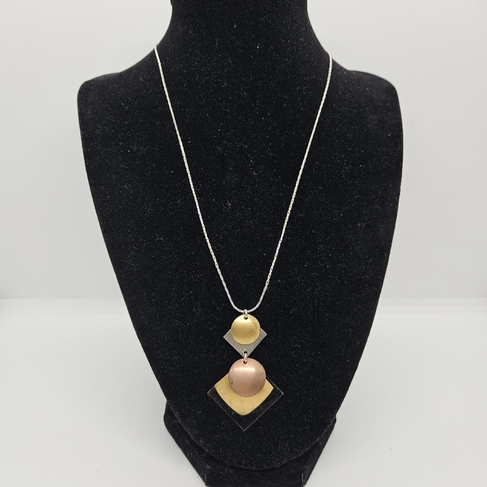 silver tone chain necklace with multi-tone geometric pendant